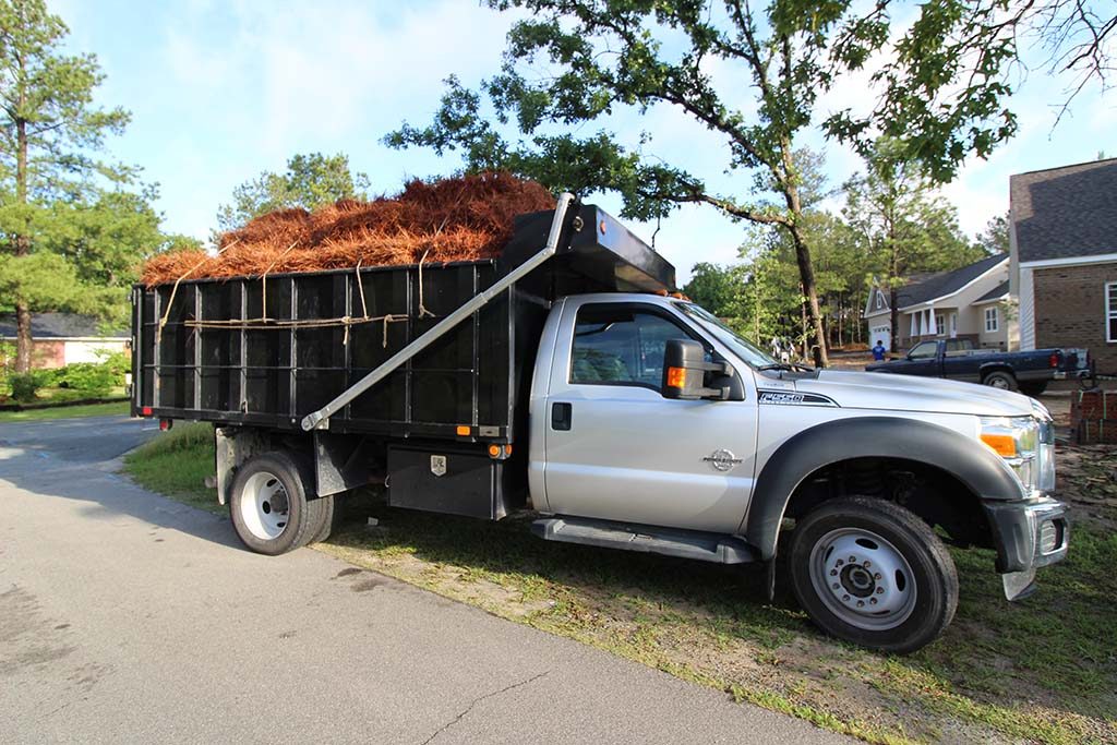 Dump Truck Hauling Pine Straw, Pinehurst NC